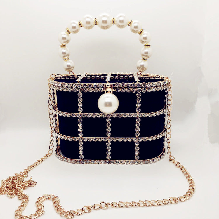Aviary Hollow Pearl Buckle Birdcage Clutch