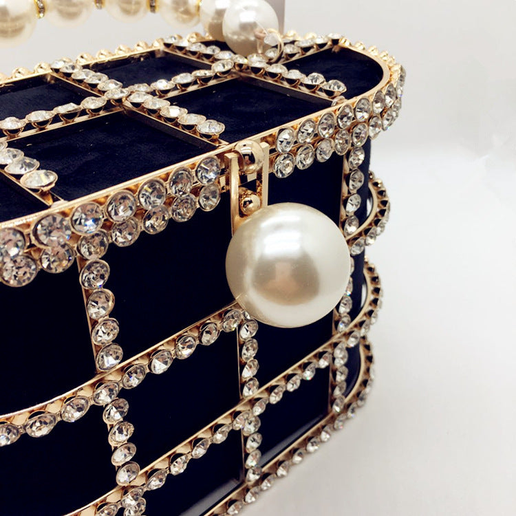 Aviary Hollow Pearl Buckle Birdcage Clutch
